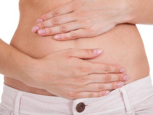 Close up of woman's hands on belly