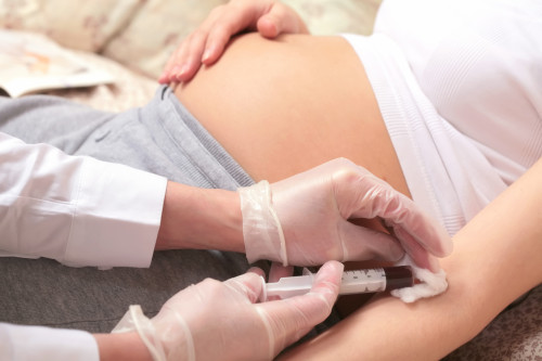pregnancy, control blood in a laboratory, hands of the doctor with syringe