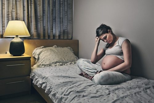 Depressed Pregnant Teen --- Image by © Justin Paget/Corbis