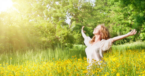 beautiful girl enjoying the summer sun outdoors in the park