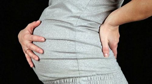 Тянущие боли внизу живота и в пояснице причины при беременности