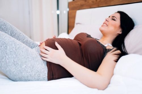 Живот каменный и болит при беременности
