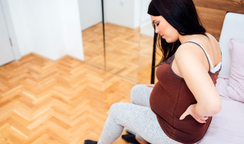 болит крестец и ноги на раннем сроке беременности